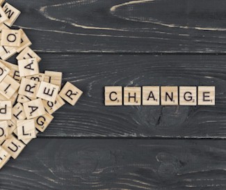 Scrabble pieces spelling CHANGE